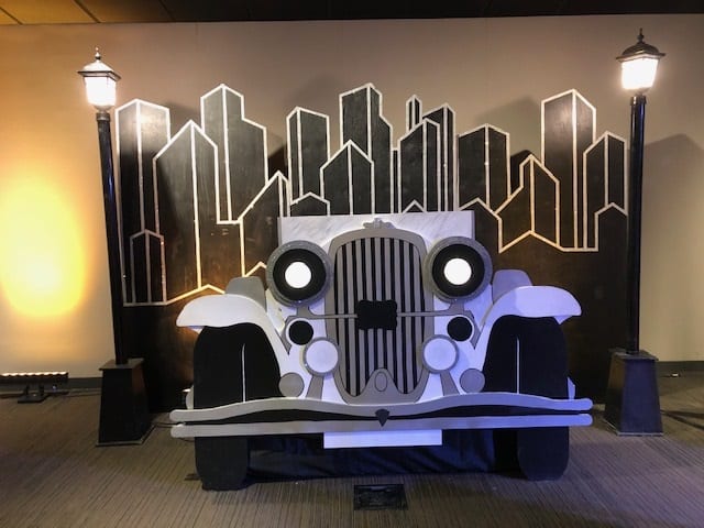Vintage Car Cut-out with 12’wide City Scape Backdrop and 2 lamp posts